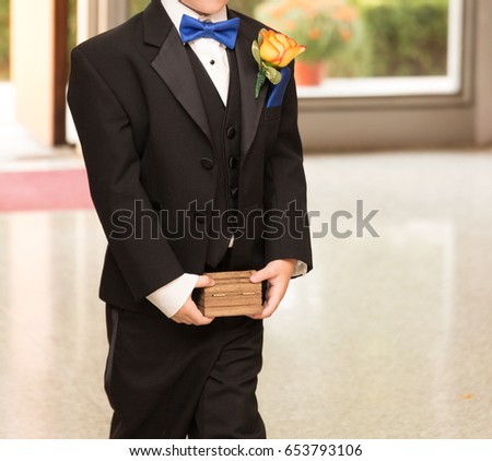 Ring Bearer with Ring in Wooden Box Royalty-Free Stock Photo #653793106