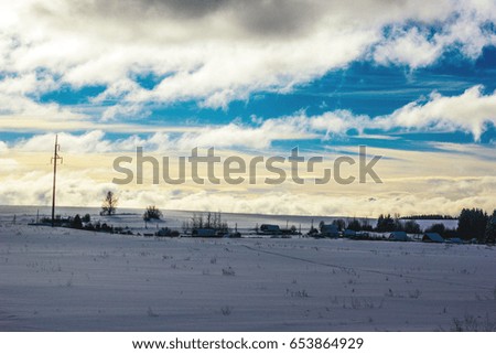 winter village road and houses snowing landscape