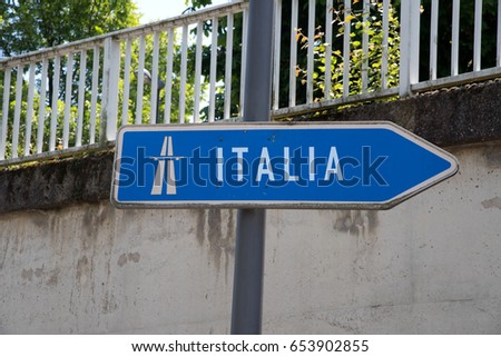 A signpost to a motorway to Italy
