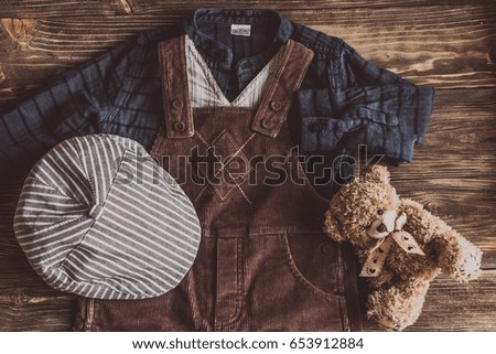 Flat lay photography of boy's casual outfits, Outfits of traveler, boy, male, Men's casual outfits on wood board background - Vintage effect style picture