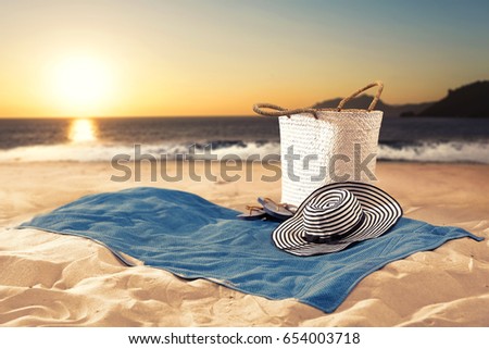 summer background of empty towel on sand 