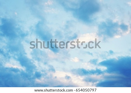 Evening blue sky with clouds. Beautiful summer sunset. Stock photo for design web site and posters