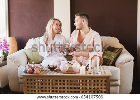 Beautiful couple enjoying spa wellness treatments