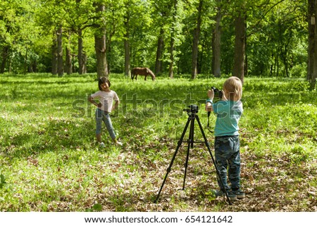 photo session for a little girl, children play photographer and model