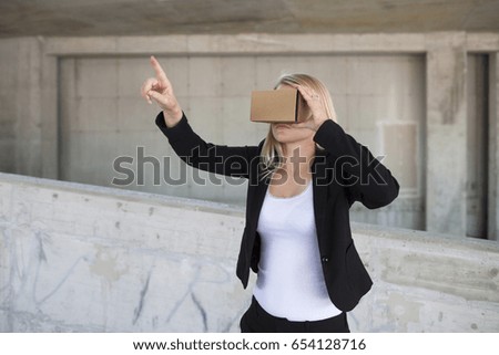 Business woman using VR goggles