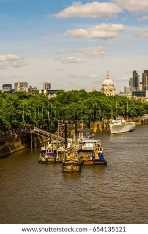 Panoramic city of london, ships on the river thames, modern and old buildings, sunny day