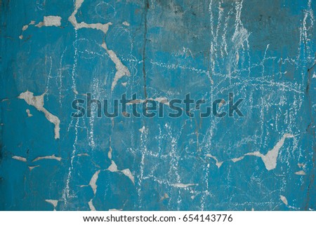 old textured blue wall color with white streaks. picture for your desktop and label in different font. paint which is very old, cracked texture
