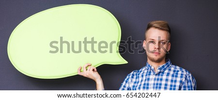 Man holding white blank speech bubble with space for text,
