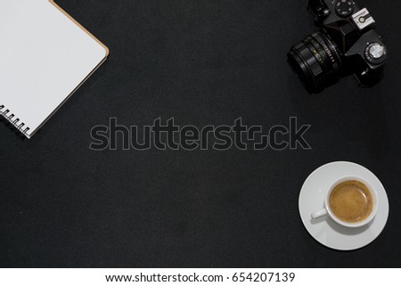 Concept of designer workplace with black background and copy space