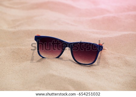 Sunglasses on summer sand beach, Fashion accessories for travel the sea and protect eyes from sunlight