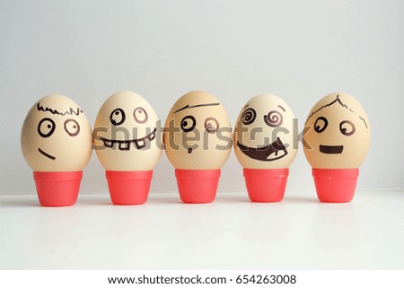 Eggs with painted face. Concept of the first September lineup. Collection of funny faces for your design