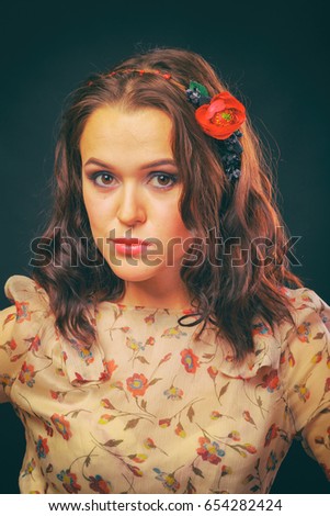 Beautiful girl in floral wreath