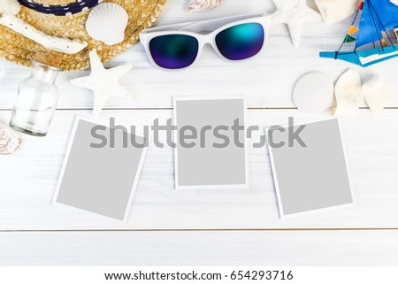 Summer Beach accessories (White sunglasses,starfish,straw hat,shell) and photo paper frame on white plaster wood table top view,Summer vacation concept,Leave space for adding your photo.