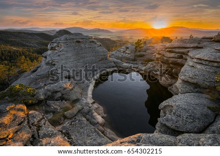 Sunset in mountains (Karkaraly national park) Royalty-Free Stock Photo #654302215