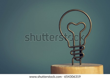 Close-up photo of lamp symbol. bulb icon with metal wire