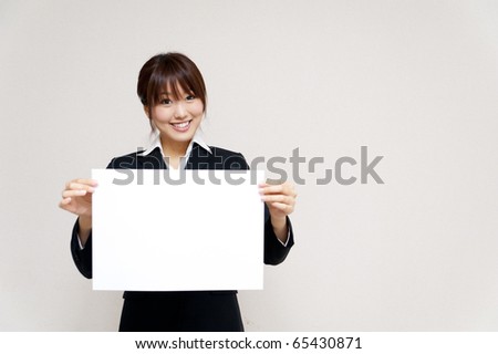 a portrait of asian business woman taking blank whiteboard  isolated on white background