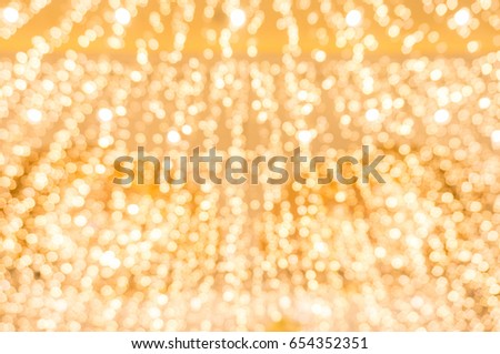 Festive abstract background with bokeh lights. Gold and blue bokeh background of new year Lights.
