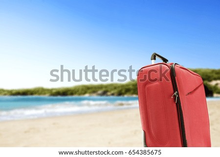 summer time and suitcase  on beach 