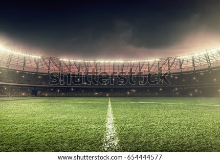 soccer field with illumination, green grass and night sky Royalty-Free Stock Photo #654444577