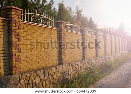 brick fence on sunset