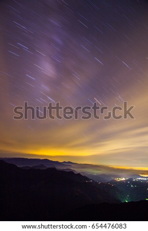 Colorful lighting reflect on the mountain with beautiful galaxy , Hehuan Mountain, night sky view, taiwan
