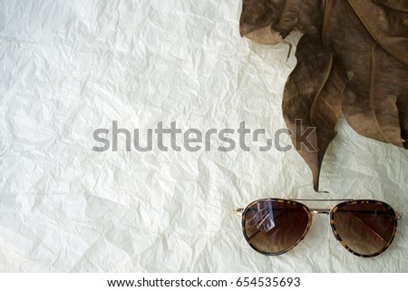 Sunglasses on the craft paper background. Full frame pic with copyspace.
