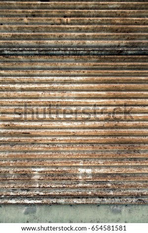 Old rusted background. Metal gate. Grunge wall