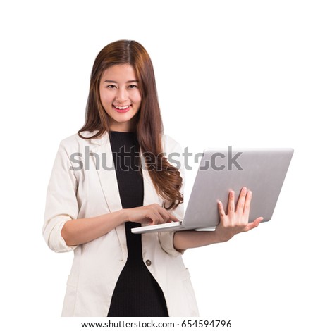 Business women holding computer for working .