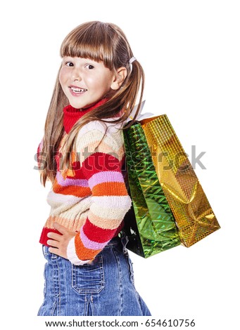 Smiling six years Girl holding presents bags isolated