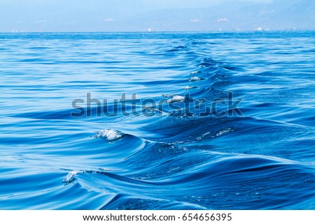 sea waves at the passage of a boat