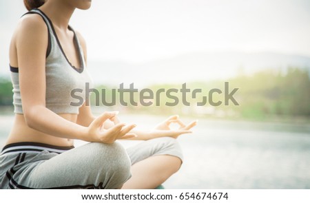 Close up hand. Yoga, Morning with women wearing sports clothes, beautiful model health care show yoga, girl yoga meditation, mountain background and sunset