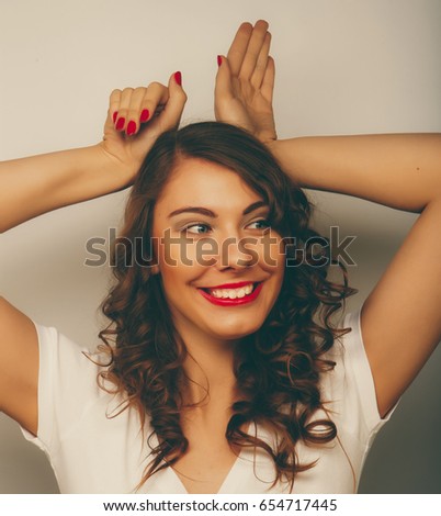 Beautiful young surprised woman.Over white background.