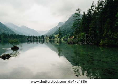 Reflections on the Lake Hintersee on a cloudy day, Bavarian Alps, Germany