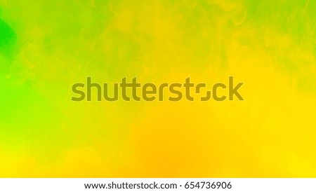 abstract Green orange background.Motion Color drop in water,Ink swirling in ,Colorful ink abstraction.Fancy Dream Cloud of ink under water