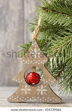 Fir branch and decor, on the wooden background.