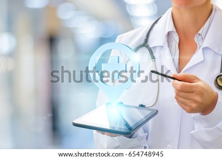 Doctor shows the location of the hospital on the tablet.