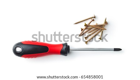 Hand screwdrivers and screws isolated on white background. Top view. Royalty-Free Stock Photo #654858001
