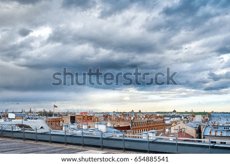 Panoramic view of Riga city, roofs under dramatic cloudy sky
