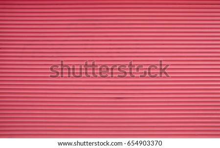 Vivid pink painted horizontal metal window roller shutter blinds or garage doors background texture