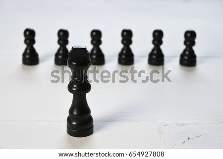 Abstract business and leadership concept with chess pieces on a white background