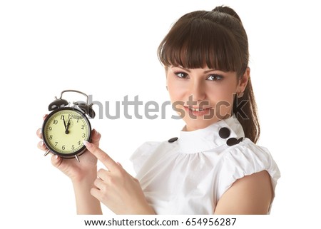 Young woman with alarm clock on a white background.