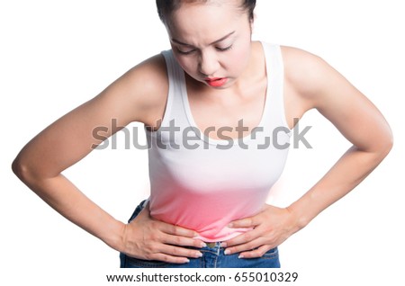 young women holding her belly in pain. isolated on white background. photo with red dot as a symbol for the hardening.