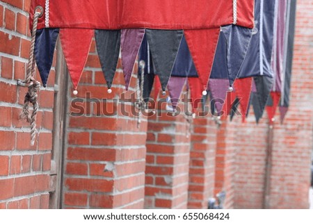 colorful flags and red brick building