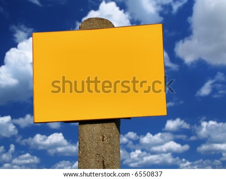 top of empty sign post against summer sky with cumulus clouds