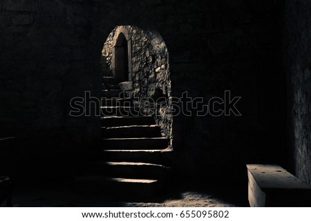 The castle dungeon with a beam of light Royalty-Free Stock Photo #655095802