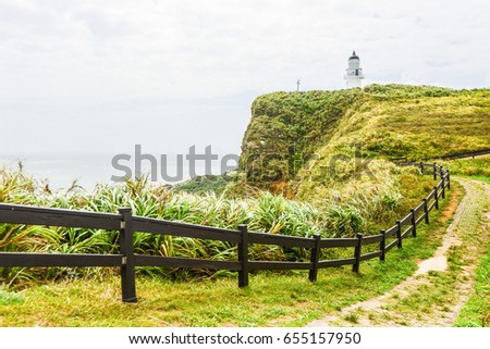 Landscape View of A Beautiful White Lighthouse (Sandiaojiao Lighthouse) at The Most East and North Coast of Taiwan, New Taipei City, Taiwan