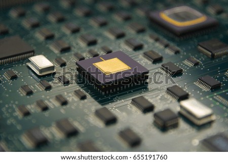 Electronic board with cpu processor and electronic chips technology concept background with DOF Effect