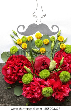 Beautiful composition with flowers and card on gray background