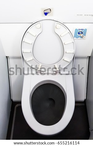 Toilet bowl in the airplane.