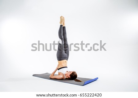 Athlete on rug does exercise